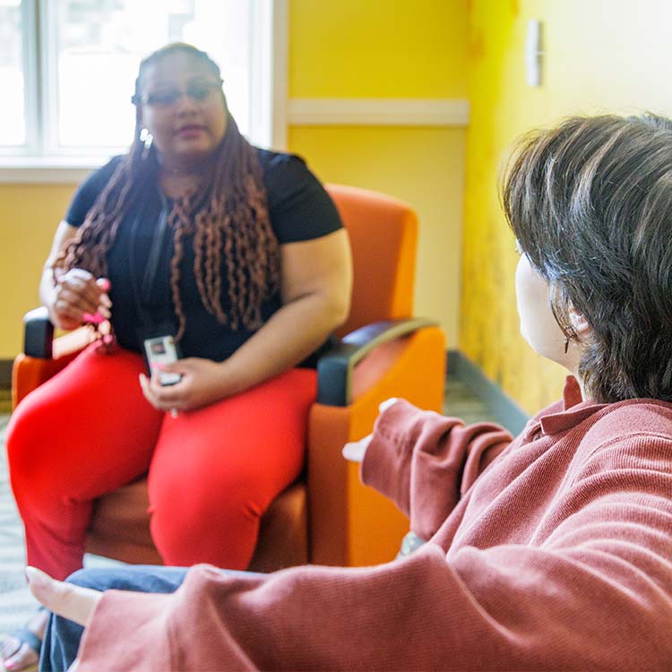 Teen discussing with therapist